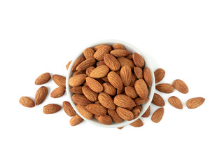 Organic almonds in ceramic bowl and heap almonds isolated top view on white background for almond nuts can improve health concept.