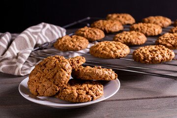 freshly baked warm oatmeal cookies on a cooling rack
