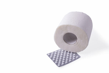 A roll of toilet paper with a package of white pills on a white background.