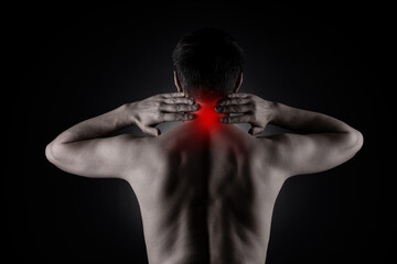 Neck pain, man with backache on black background