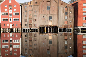 Reflections of old wooden storehouses in Trondheim, Norway