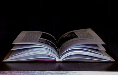 mysterious book on black background 
