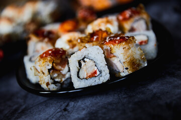 Set of Japanese sushi roll on dark background