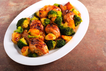 Roast chicken drumsticks with potato