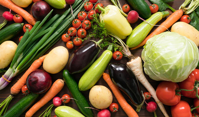 vegetables assortment on dark wooden surface, top view