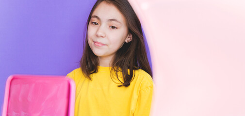 A girl blogger talks to subscribers, conducts a live broadcast, looks at the smartphone screen. Make a video call to friends and parents. Social networks