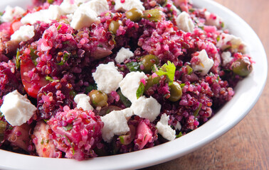 Closeup shot of beet salad with quinoa and chicken