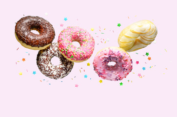 Flying donuts on a pink background.