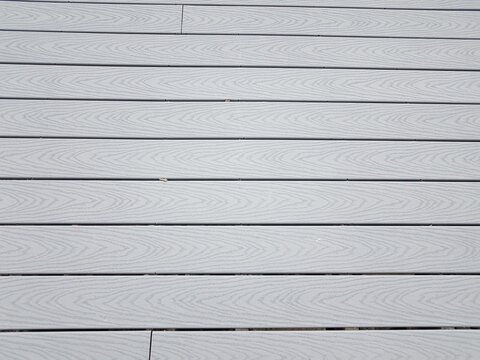 grey artificial or composite wood boards on deck with lines