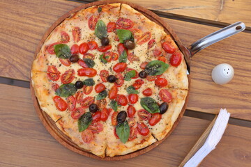 Top View Margarita pizza on a wooden table
