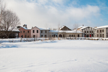 Fototapeta na wymiar an old abandoned town. Old ruined houses winter snow covered nature winter