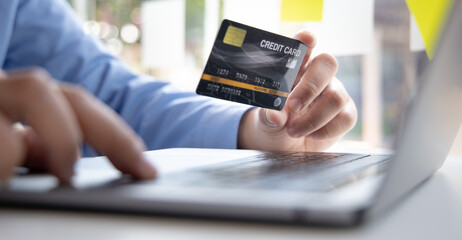 Online product purchase, Businessman use laptop register via credit cards to make online purchases, Shopping and mail, credit card online security, Online shopping concept...
