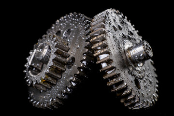 Water drops on gear wheels. Wet spare parts for an internal combustion engine.