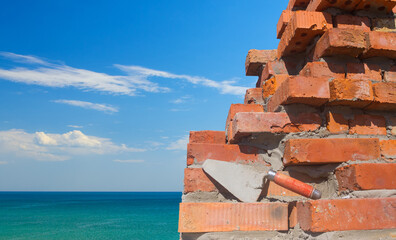 Brick wall of a house near the sea