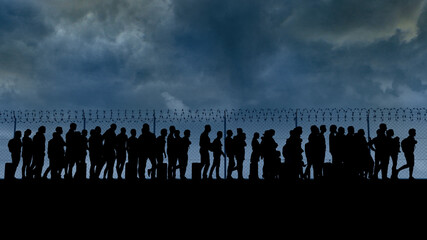 Refugees and immigrants looking for a new life. Column of migrants near the state borders. Fence and barbed wire. Surveillance, supervised. Abandon their lands for a better future. Silhouette - obrazy, fototapety, plakaty