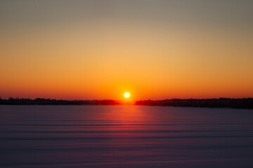 Sunrise over the frozen lake