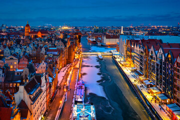 Beautiful old town in Gdansk over Motlawa river at winter dusk, Poland