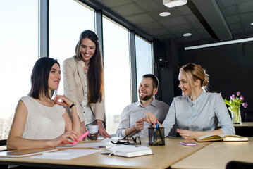 Team of young people in the office working