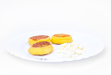 Fried cottage cheese on a plate