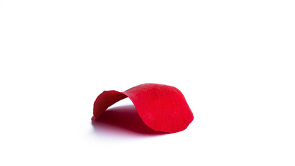 Red rose petal isolated on a white background. Flying petals