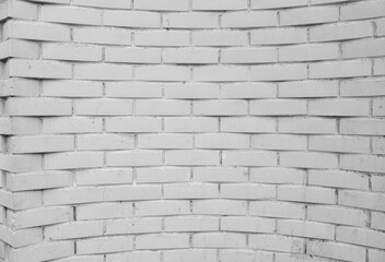 Brick wall painted with white paint.