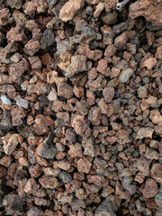 Rocky volcanic rubbles of different red colours at Reunion island volcano Piton de la fournaise