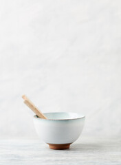 Traditional, handcrafted ceramic on bright wooden background. Copy space.	