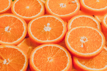 Texture of sliced orange, fresh and healthy fruit, which is rich in juice and vitamin c. Orange background.