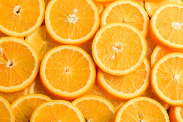 Texture of sliced orange, fresh and healthy fruit, which is rich in juice and vitamin c. Orange background.