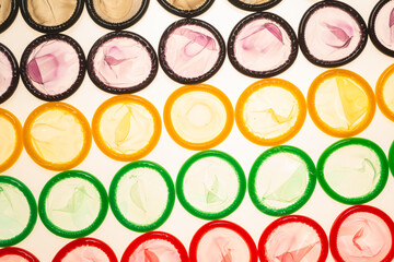 Colorful condoms background.