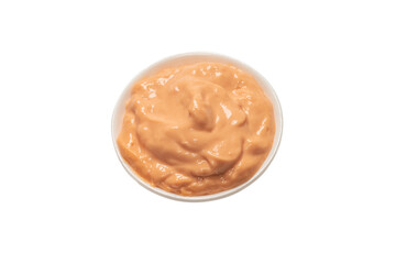 Sauce in a bowl isolated on white.