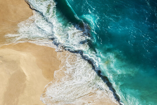 Drone point of view - Ocean waves at the with turquoise water