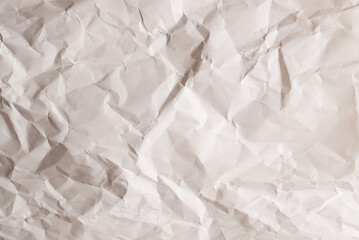 Crumpled white paper background.