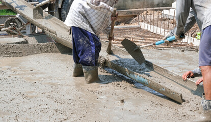Group Team of worker working material in site. mixer cement truck pour fluid concrete into  floor...