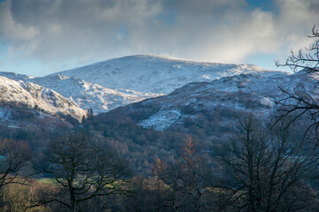 Snow covered fells of the Langdale Valley, Cumbria in winter sunshine