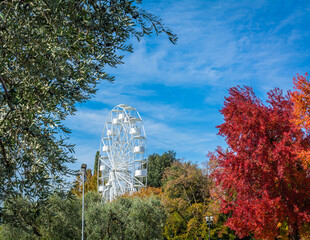 Ferris wheel in Bardolino Harbour, Bardolino on Garda lake, Veneto region, northern Italy - october...