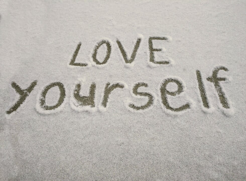 The inscription on the snow LOVE YOURSELF