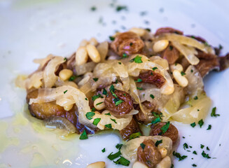 specialties like 'sarde in saor', typical Venetian dish. traditional sweet with sardines, pine nuts...