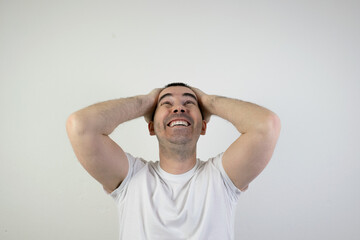 happy excited young man stand white background laugh hands up crazy look angry