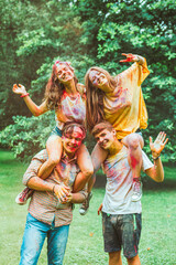 Fototapeta premium young happy friends at holi fest