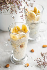 Banana chia pudding. Dessert with chia seeds, almonds and banana. A healthy dietary dessert.