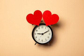 alarm clock with two hearts, time to love