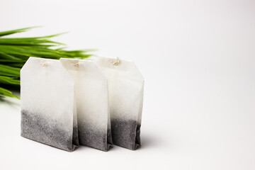 Tea bags without a label on a white background. Place for text and inscription.