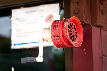 OOld style manual fire alarm (air horn) using by spining the handle to activate sound for emergency case.
