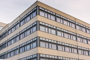 Corner of a glass and concrete office building.