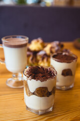 Traditional Italian dessert tiramisu in a glass.