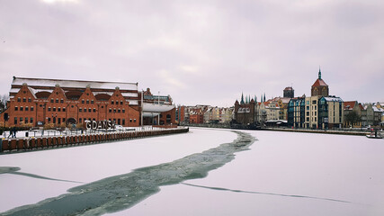 View of Gdansk old Town from the Motlawa River, Poland. Ancient European city. Winter scenery.
