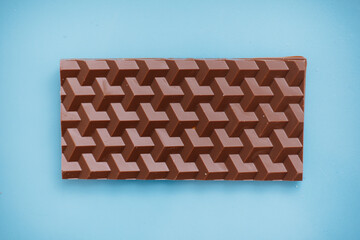 Natural handmade chocolate close-up on a bright background.