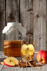 Kombucha cocktail with apples and cinnamon. It is a fermented beverage. Not only does it have the same benefits as tea, but it is also rich in beneficial probiotics.