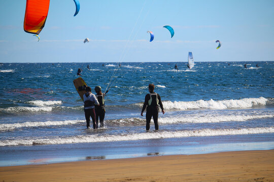 Instructor and students during kitesurf courses at the beach of the Atlantic ocean (Tenerife, Spain)